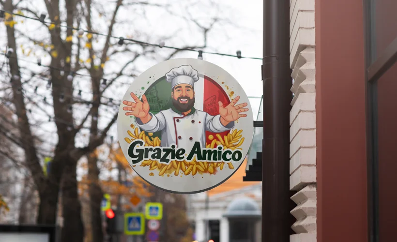 A store sign featuring the cartoon logo of Grazie Amico, a pizza and pasta restaurant by an Italian immigrant.